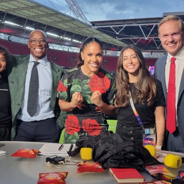 Georgia De Souza stands with Gabby Logan, Alex Scott, Ian Wright and Jonas Eidevall working for BBC Sport