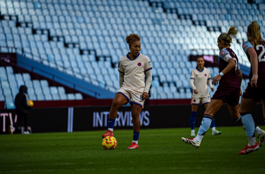 Lauren James in a white Chelsea away shirt playing against Aston Villa