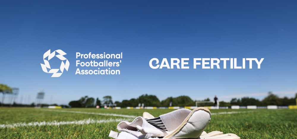 A pair of white football boots rests on the grass beside a football pitch beneath a clear blue sky, with the Professional Footballers' Association and Care Fertility logos displayed prominently above the horizon.