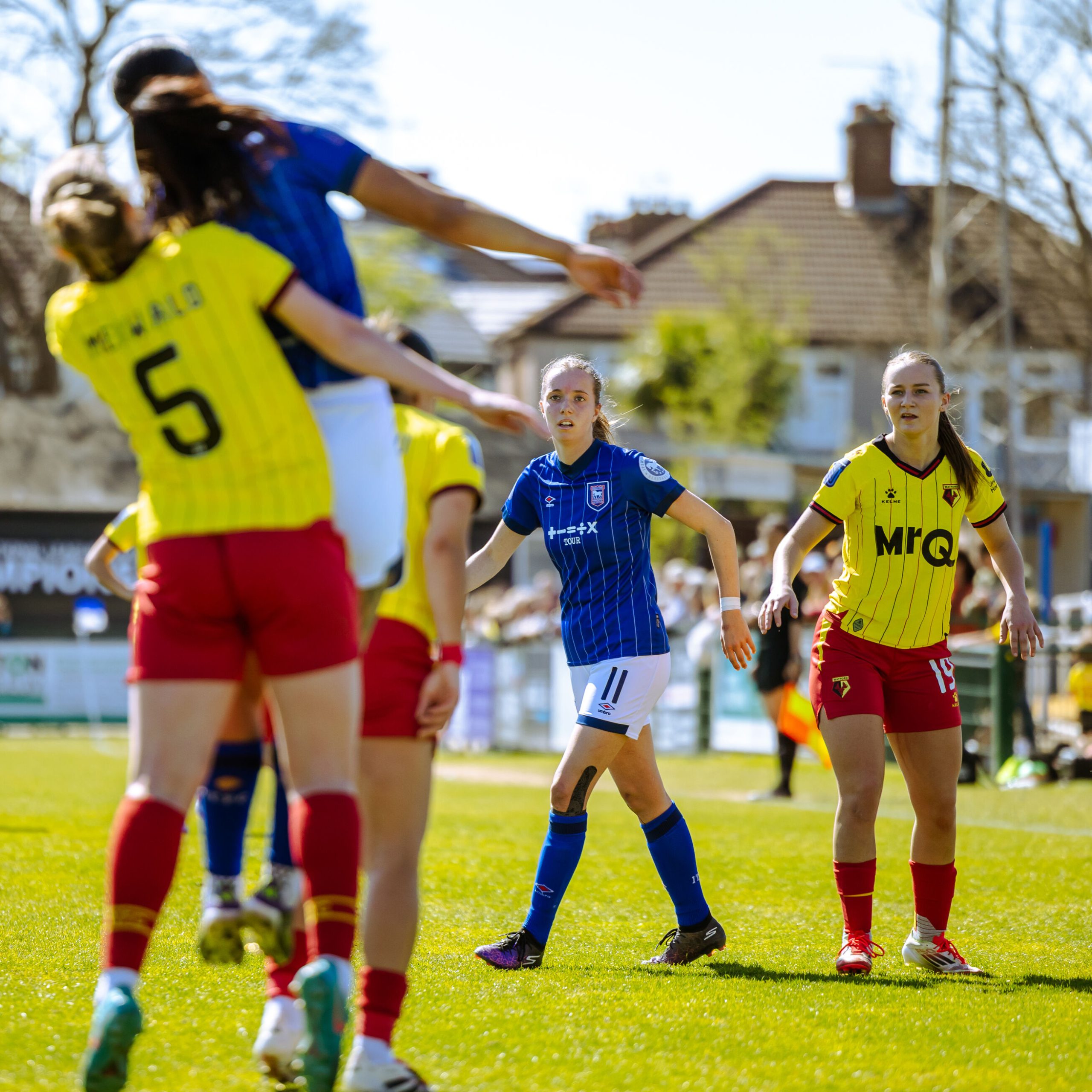 Several Watford players dive to win headers on pitch when playing Ipswich.