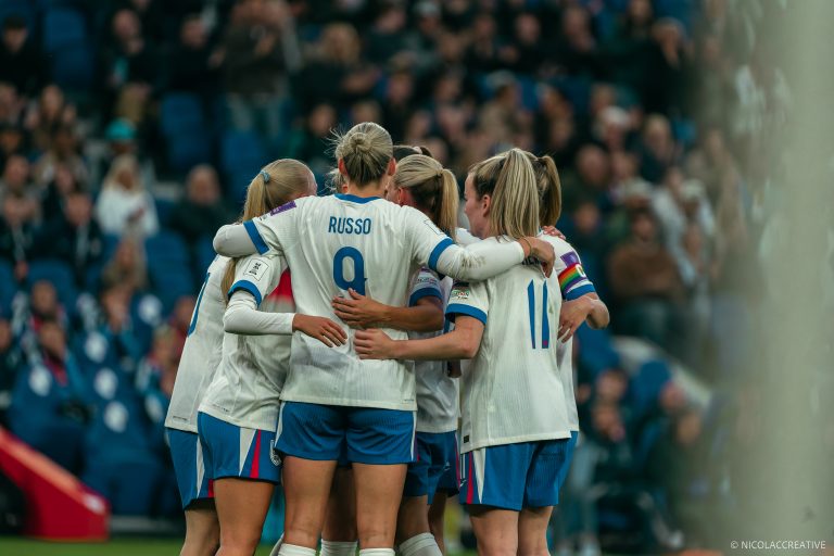 Lionesses team celebration in the middle of the Pitch
